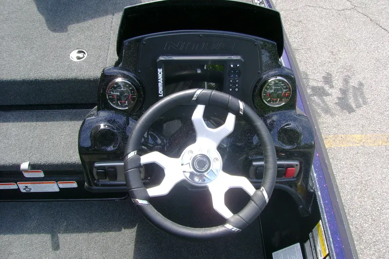 Slide: The Image of Steering console of a 2027 Nitro Z17 boat with gauges and controls. - 10
