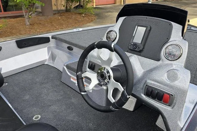 Slide: The Image of 2027 Nitro Z17 boat dashboard with steering wheel and navigation system. - 7
