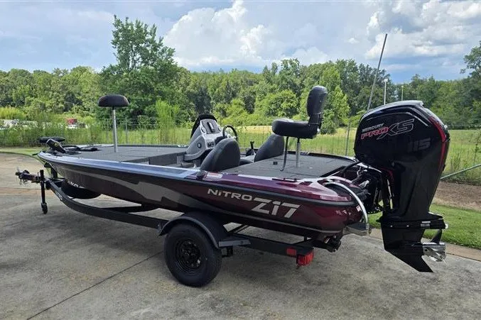 Slide: The Image of 2027 Nitro Z17 boat with Mercury Pro XS engine, parked outdoors on a sunny day. - 1