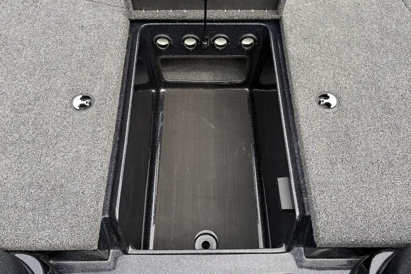 Slide: The Image of 2027 Nitro Z17 boat storage compartment with gray carpeted interior and metal latches. - 36