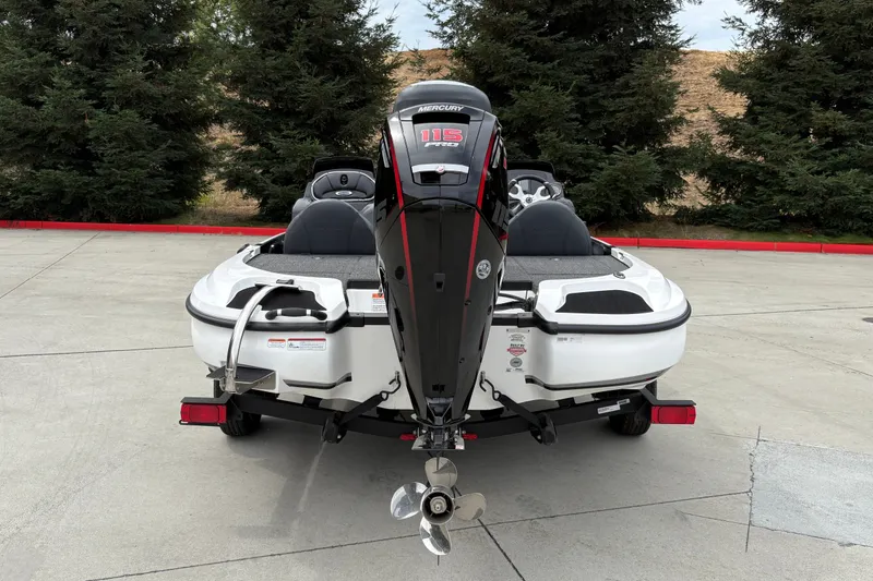 Slide: The Image of 2027 Nitro Z17 boat with Mercury 115 Pro XS engine, parked outdoors. - 12