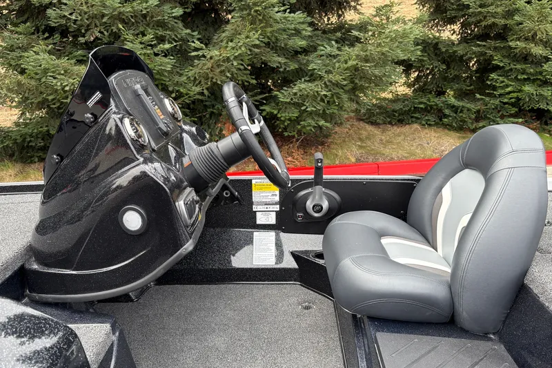 Slide: The Image of Nitro Z17 2027 boat cockpit with steering wheel and cushioned seat. - 18