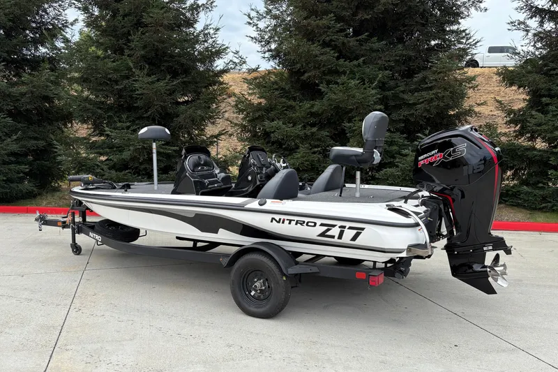 Slide: The Image of 2027 Nitro Z17 boat with Mercury Pro XS engine, parked outdoors. - 2