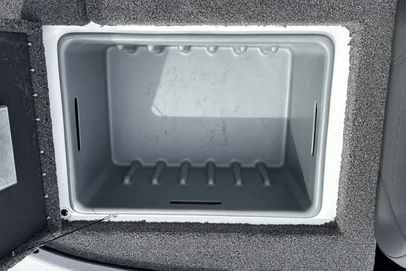 Slide: The Image of Empty storage compartment in a 2027 Nitro Z17 boat, featuring a gray interior. - 26