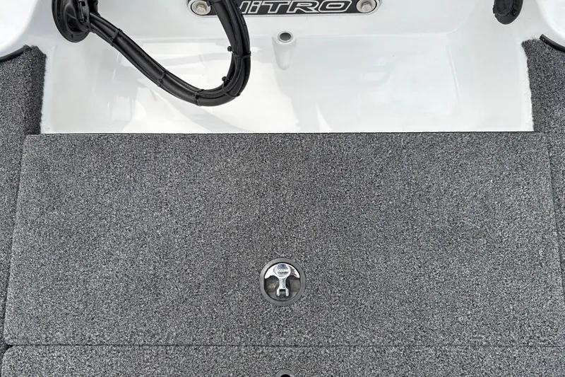 Slide: The Image of Carpeted deck of a 2027 Nitro Z17 boat with a latch and wiring. - 33