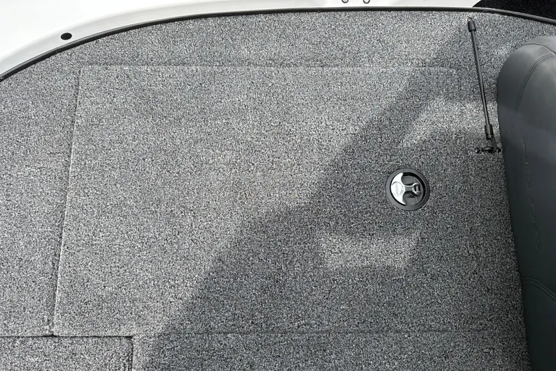 Slide: The Image of Carpeted deck of 2027 Nitro Z17 boat with storage compartment and latch. - 38