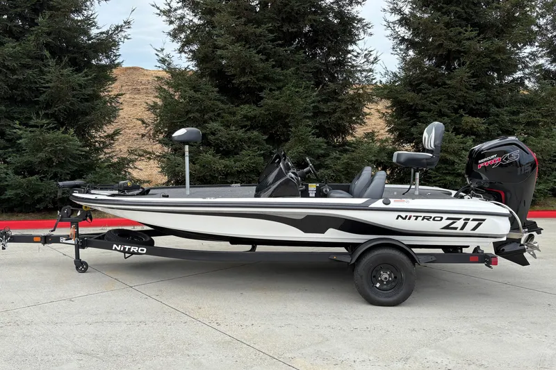 Slide: The Image of 2027 Nitro Z17 fishing boat with Mercury Pro XS engine, parked outdoors. - 1
