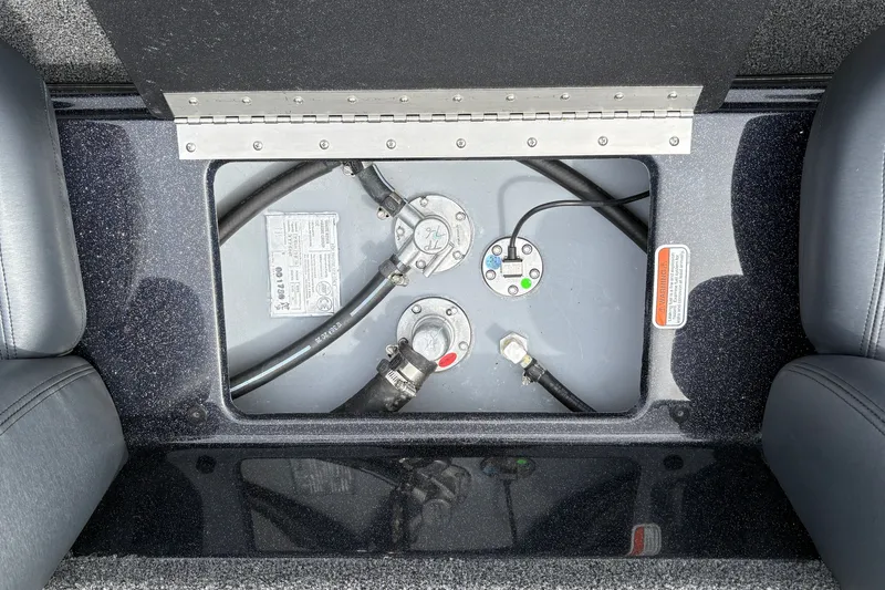 Slide: The Image of Fuel compartment of a 2027 Nitro Z17 boat, showing hoses and connections. - 29
