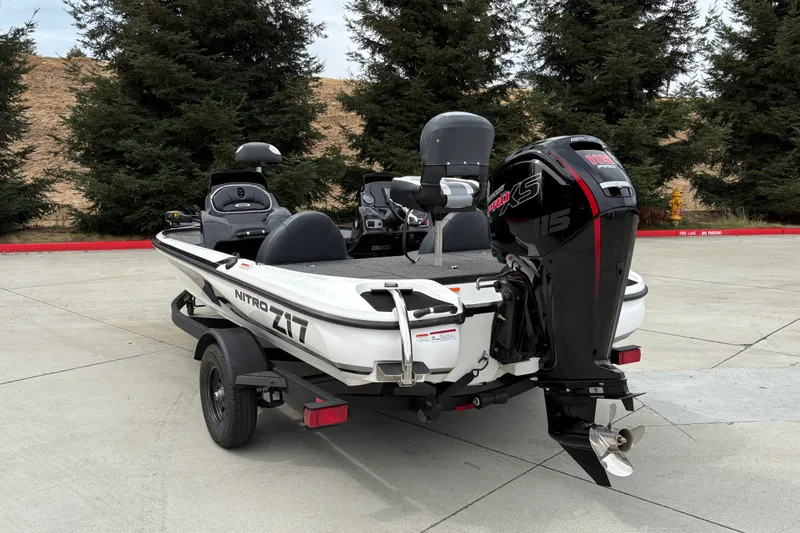 Slide: The Image of 2027 Nitro Z17 boat with Mercury Pro XS engine, parked outdoors. - 11