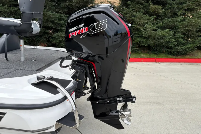 Slide: The Image of Nitro Z17 2027 boat with Mercury Pro XS 115 outboard motor, parked outdoors. - 10