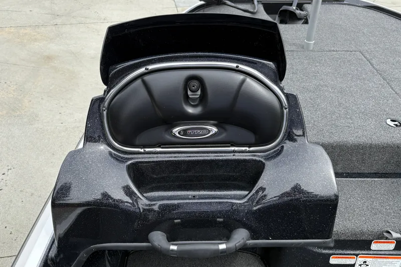 Slide: The Image of 2027 Nitro Z17 boat storage compartment with sleek black finish and logo. - 22