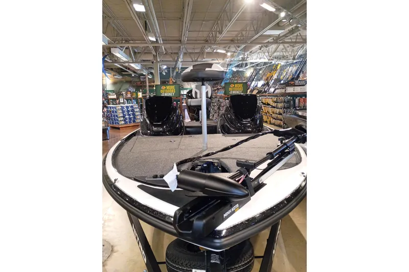Slide: The Image of 2027 Nitro Z17 boat displayed in a store, featuring fishing equipment and accessories. - 3