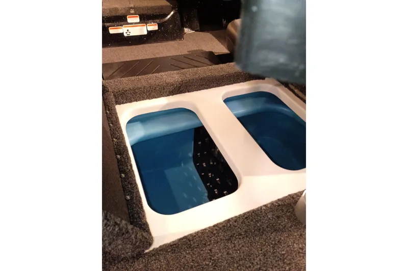 Slide: The Image of 2027 Nitro Z17 boat interior storage compartments with blue lining. - 5