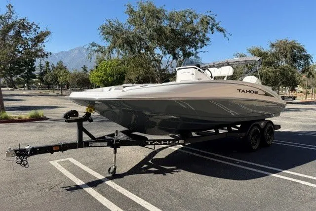 Slide: The Image of 2026 Tahoe 2150 CC boat on trailer in sunny parking lot. - 5