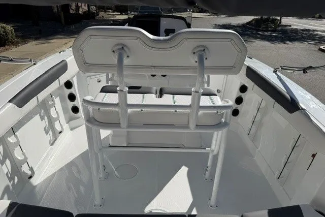 Slide: The Image of 2026 Tahoe 2150 CC boat interior with seating and rod holders. - 8