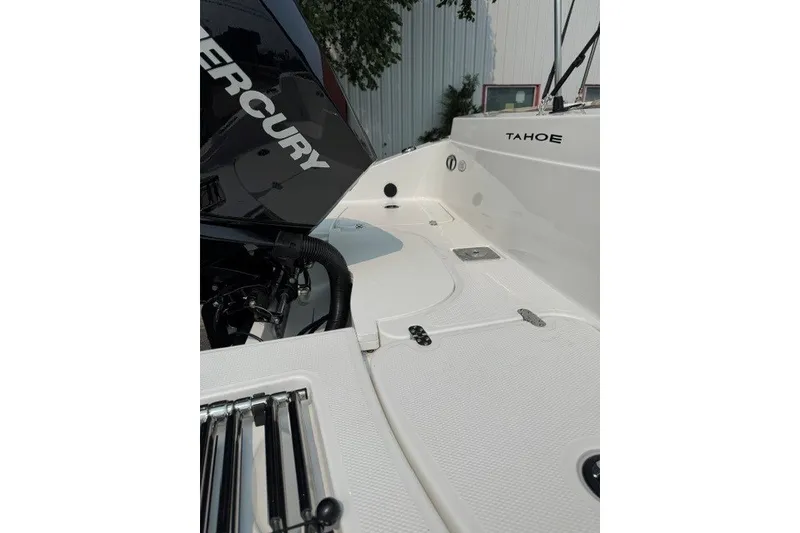 Slide: The Image of 2026 Tahoe 2150 CC boat deck with Mercury engine, showcasing sleek design and functionality. - 18