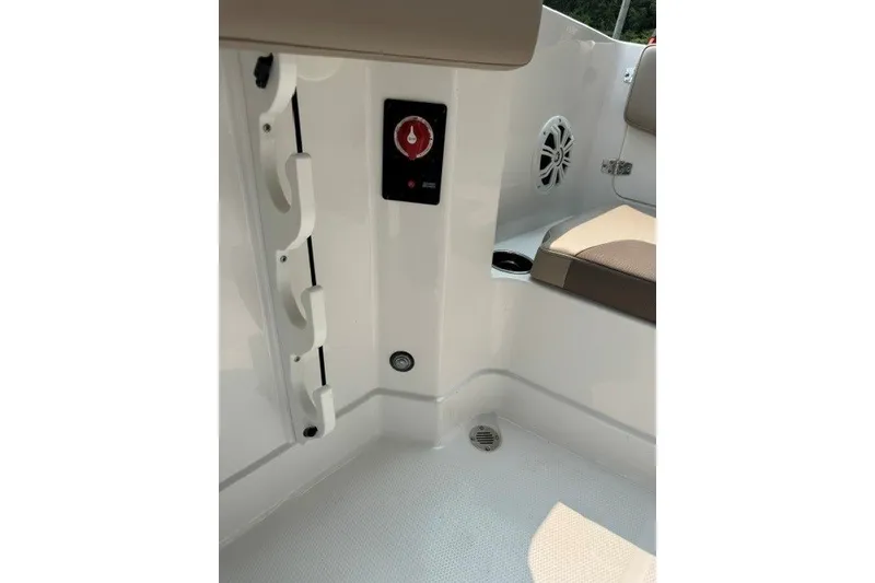 Slide: The Image of Interior view of 2026 Tahoe 2150 CC boat, featuring seating and control panel. - 17