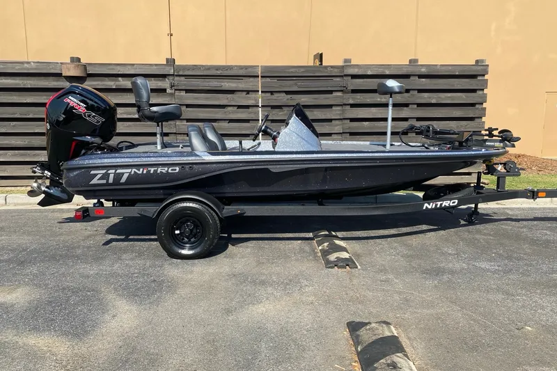 The Image of 2027 Nitro Z17 boat with motor, parked on trailer, side view. - 0