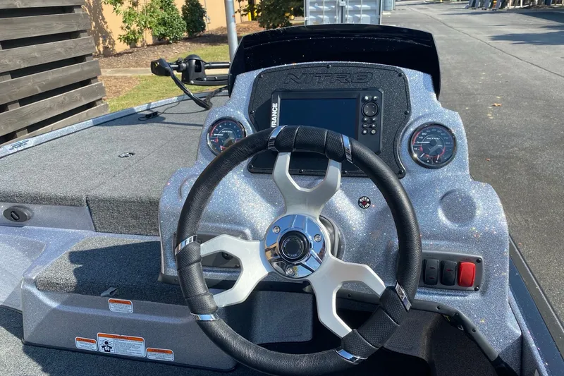 Slide: The Image of Steering console of a 2027 Nitro Z17 boat with modern controls and dashboard. - 5