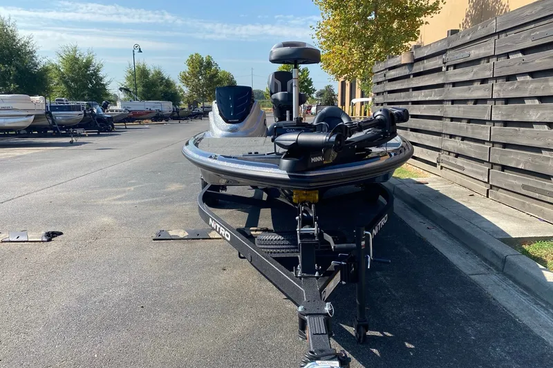 Slide: The Image of Front view of a 2027 Nitro Z17 boat on a trailer in a parking lot. - 3