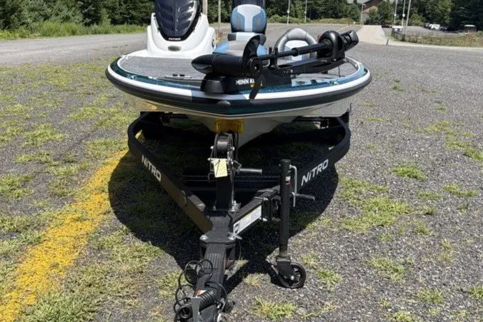 Slide: The Image of Front view of a 2027 Nitro Z17 boat on a trailer in a parking area. - 8
