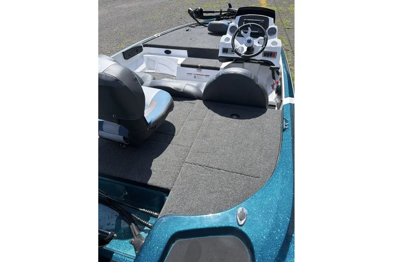 Slide: The Image of Interior view of a 2027 Nitro Z17 boat, featuring seating and steering console. - 10