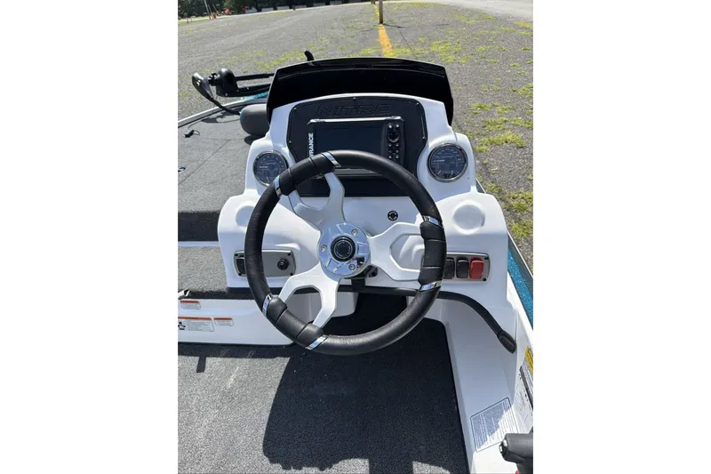 Slide: The Image of Steering console of a 2027 Nitro Z17 boat with modern controls and dashboard. - 11