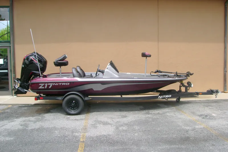 The Image of 2027 Nitro Z17 boat on trailer, parked outdoors, side view. - 0