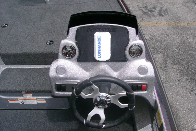 Slide: The Image of Steering console of a 2027 Nitro Z17 boat with Lowrance display and gauges. - 101