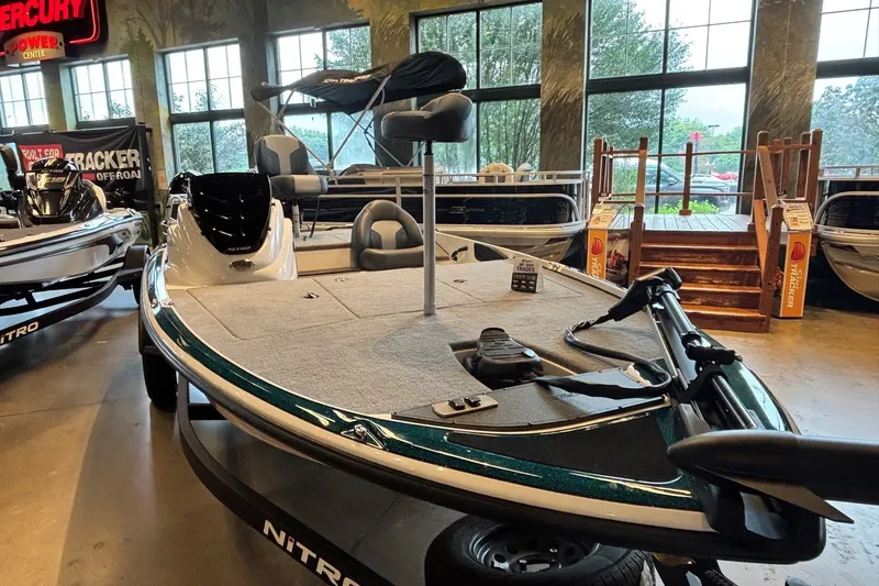 Slide: The Image of 2027 Nitro Z17 boat displayed indoors with fishing equipment and seating. - 2