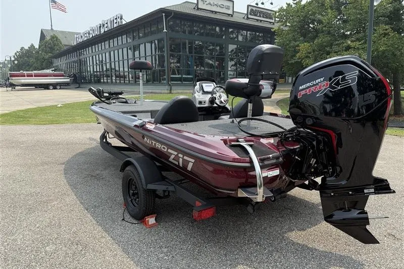 Slide: The Image of 2027 Nitro Z17 boat with Mercury Pro XS engine parked outside a boat center. - 5