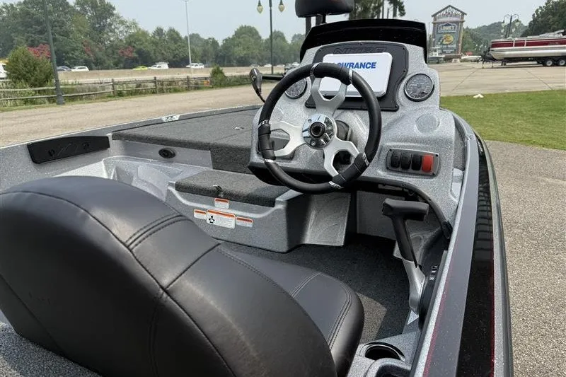 Slide: The Image of Interior of a 2027 Nitro Z17 boat featuring a sleek steering wheel and dashboard controls. - 10
