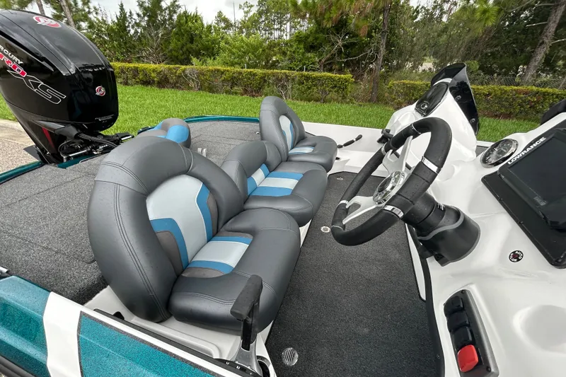 Slide: The Image of 2027 Nitro Z17 boat interior with steering wheel and cushioned seats. - 11