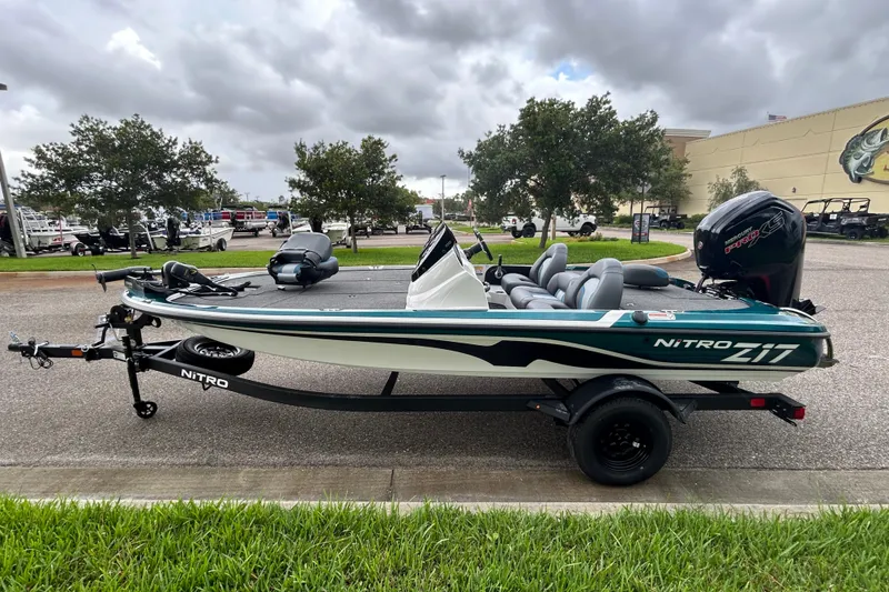 Slide: The Image of 2027 Nitro Z17 boat on trailer, parked outdoors under cloudy sky. - 4