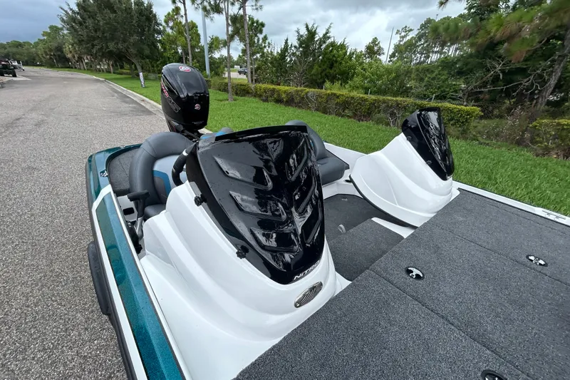 Slide: The Image of Nitro Z17 2027 boat with dual consoles and outboard motor on a scenic road. - 10