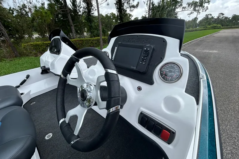 Slide: The Image of Steering console of a 2027 Nitro Z17 boat with dashboard controls and gauges. - 12