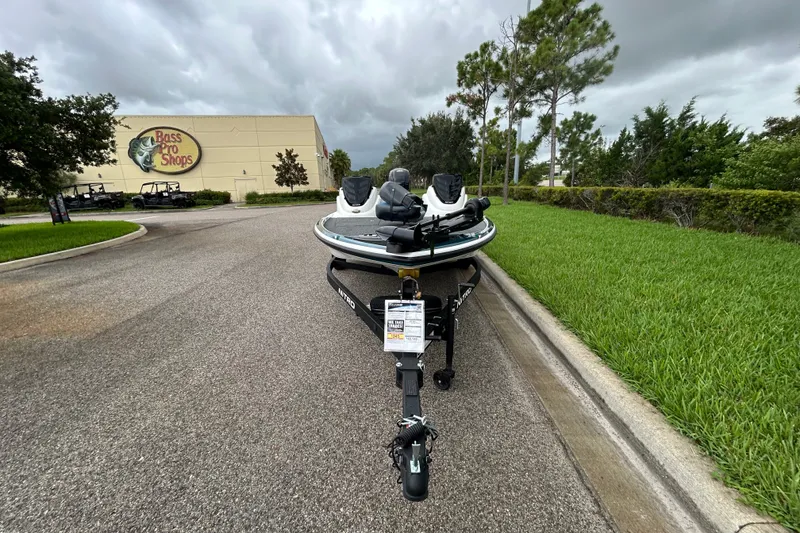 Slide: The Image of 2027 Nitro Z17 boat parked outside Bass Pro Shops on a cloudy day. - 6