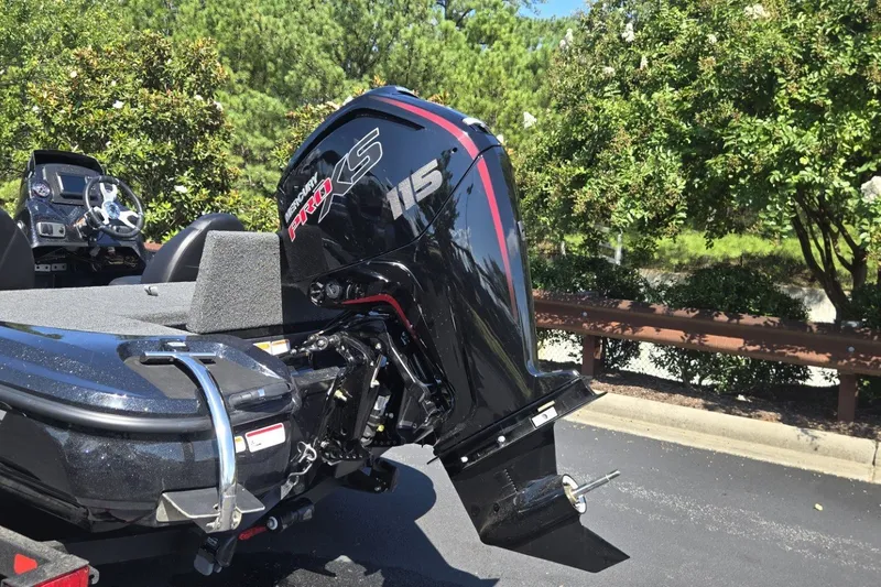 Slide: The Image of Nitro Z17 2027 boat with Mercury Pro XS 115 outboard motor in a sunny outdoor setting. - 1