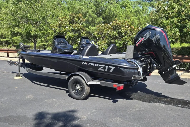 Slide: The Image of 2027 Nitro Z17 boat on trailer with powerful outboard motor, parked outdoors. - 3