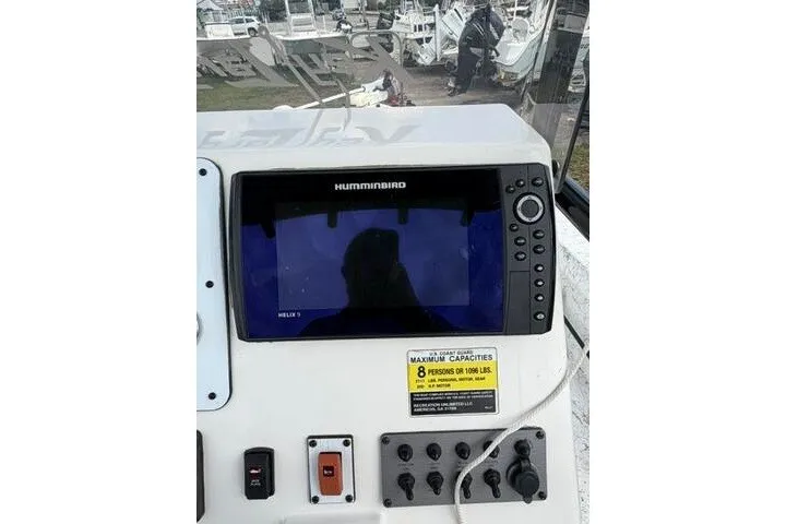 Slide: The Image of Control panel of a 2018 Key Largo 220 Bay boat with Humminbird display. - 19