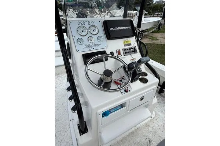 Slide: The Image of 2018 Key Largo 220 Bay boat console with steering wheel and Humminbird electronics. - 17