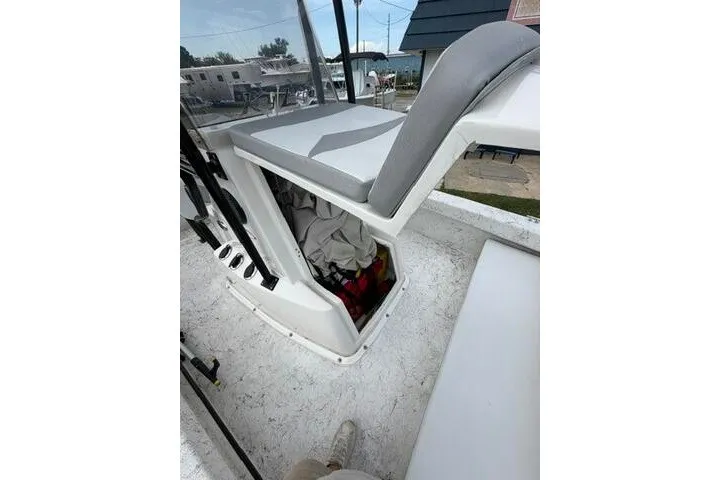 Slide: The Image of 2018 Key Largo 220 Bay boat interior with storage compartment open. - 10