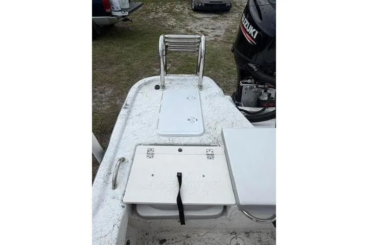 Slide: The Image of 2018 Key Largo 220 Bay boat with Suzuki outboard motor and rear deck ladder. - 21