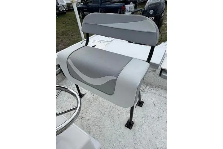 Slide: The Image of 2018 Key Largo 220 Bay boat seat with gray and white upholstery. - 16