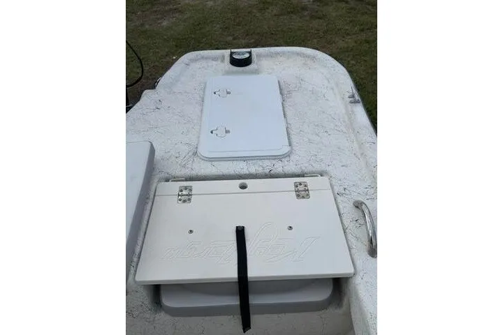 Slide: The Image of 2018 Key Largo 220 Bay boat deck with storage compartments and textured surface. - 25