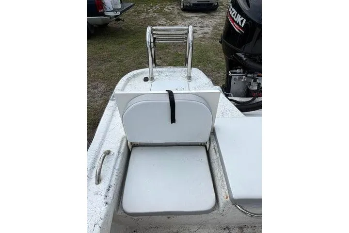 Slide: The Image of 2018 Key Largo 220 Bay boat with foldable seat and Suzuki outboard motor. - 23