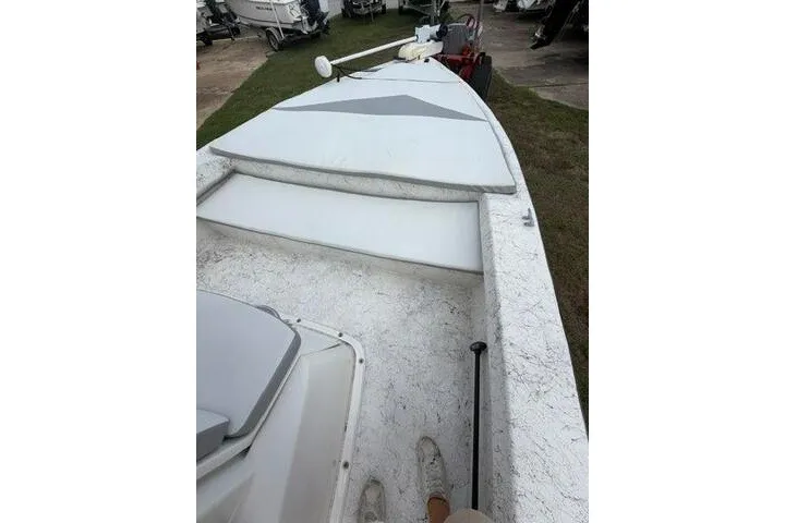 Slide: The Image of 2018 Key Largo 220 Bay boat interior with seating and storage compartments. - 9