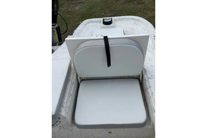 Slide: The Image of 2018 Key Largo 220 Bay boat seat with white cushion and black strap. - 26