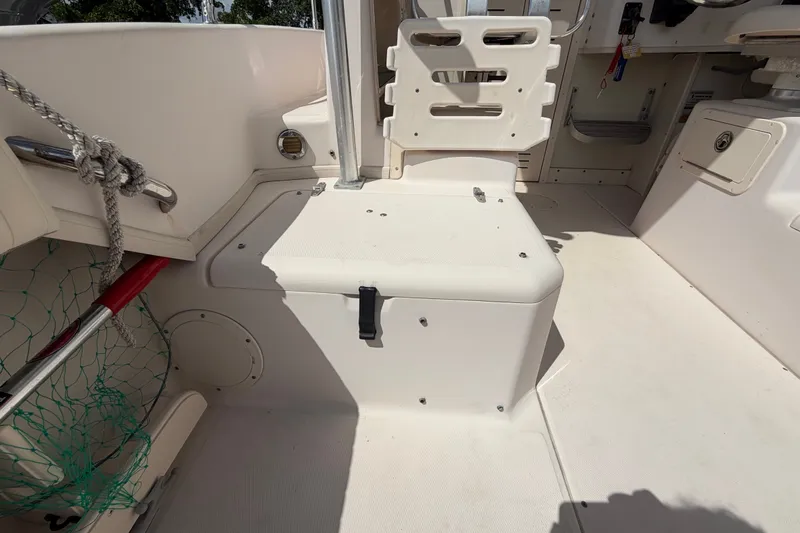 Slide: The Image of 2008 Grady-White Seafarer 226 boat interior with seating and storage compartments. - 53
