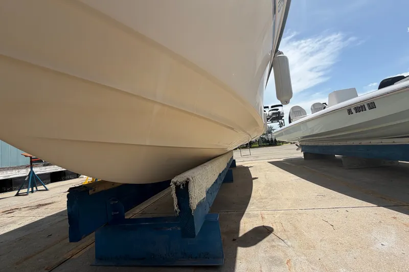 Slide: The Image of 2008 Grady-White Seafarer 226 boat on dry dock, sunny day, side view. - 63